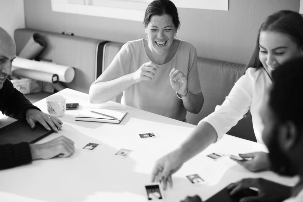 Employees happy brainstorming black and white