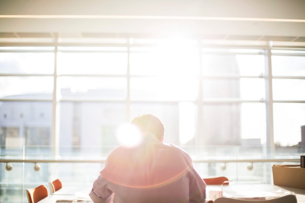 employee alone in the office sunlight